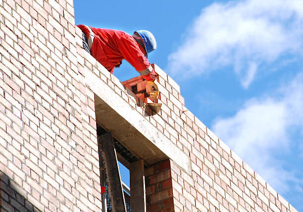 The mason behind work. House building.