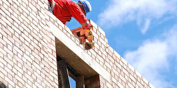 The mason behind work. House building.