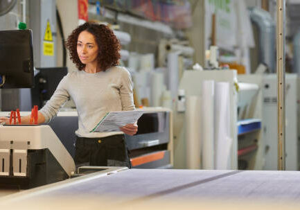 woman plotting cnc machine