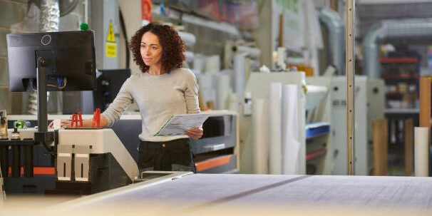 woman plotting cnc machine